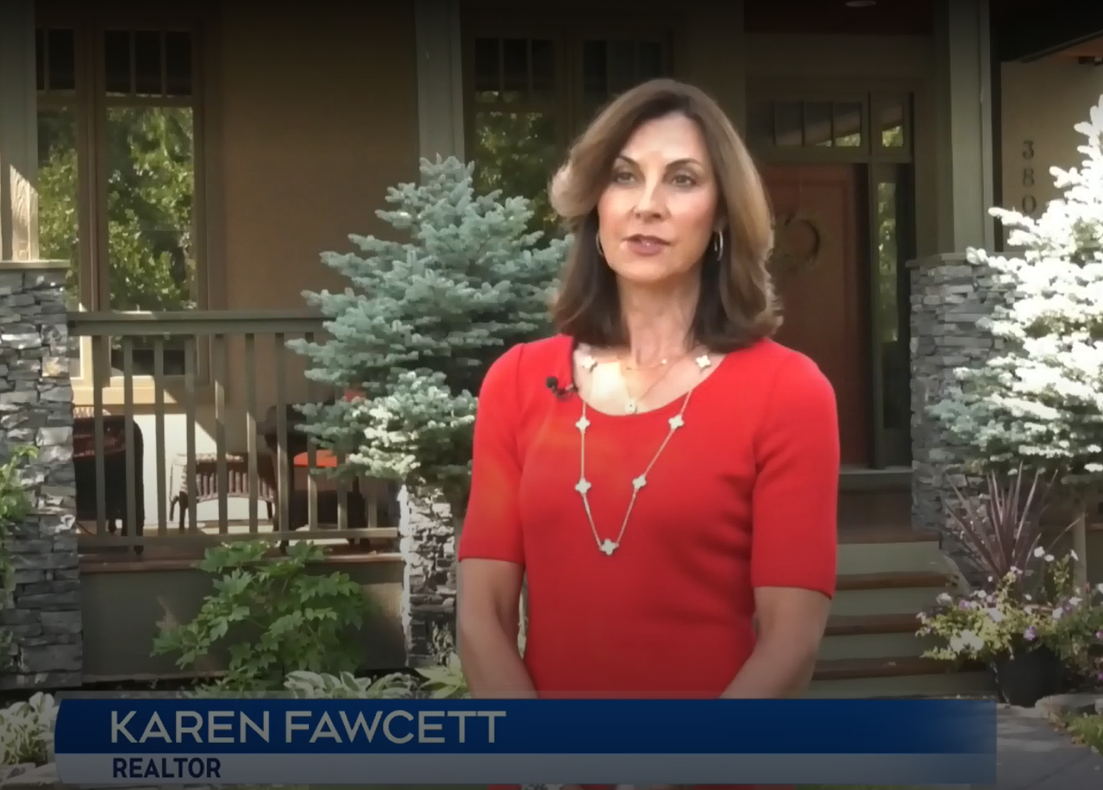 A person in a red dress
Description automatically generated