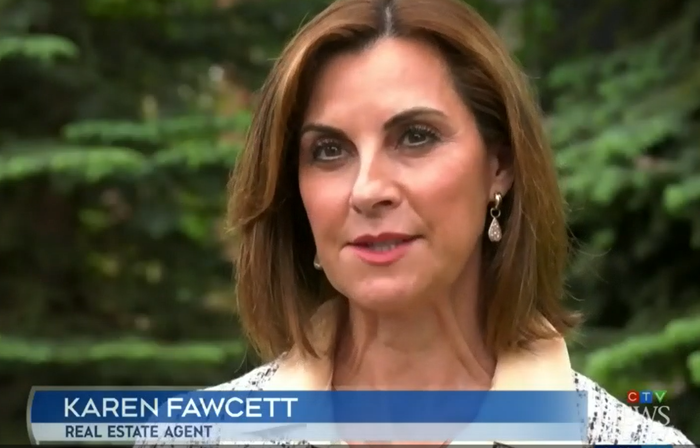 A person with brown hair and earrings
Description automatically generated